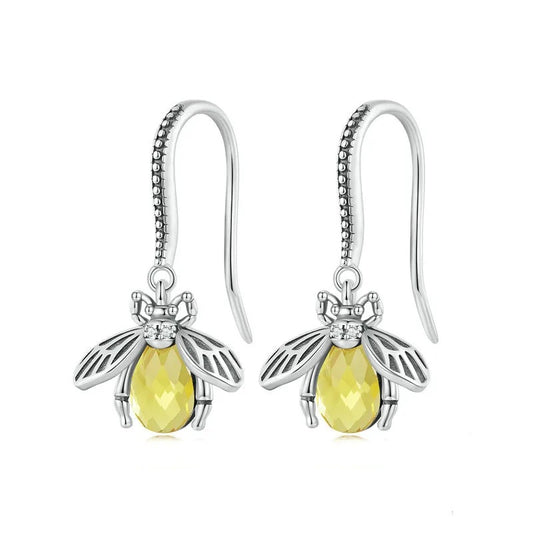 Silver bee drop earrings with golden stones.