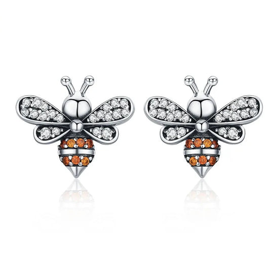 Silver bee earrings with cubic zirconia gemstones.